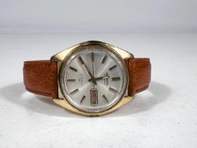 A SEIKO automatic 21 jewel, gentleman's wrist watch on a brown leather strap.