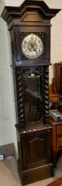 An early 19th century longcase clock with silvered dial, glass door and barley twist side columns,