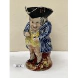 A 19th century Staffordshire character jug, the snuff taker. 8' high