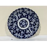 A 1920s Japanese blue and white charger with wavy rim. 12' diam.