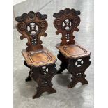 A pair of 19th century 'Sgabello' Renaissance style hall chairs with shaped and pierced scroll