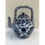 A Chinese blue and white teapot, decorated with dragons. Six figure character mark to base. 12'