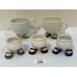 Carlton Ware. A pair of 'Walk Ware' tea cups and three eggcups