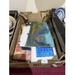 A box of unframed artworks