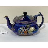 A Carlton Ware Persian pattern lustre teapot. 4½' high