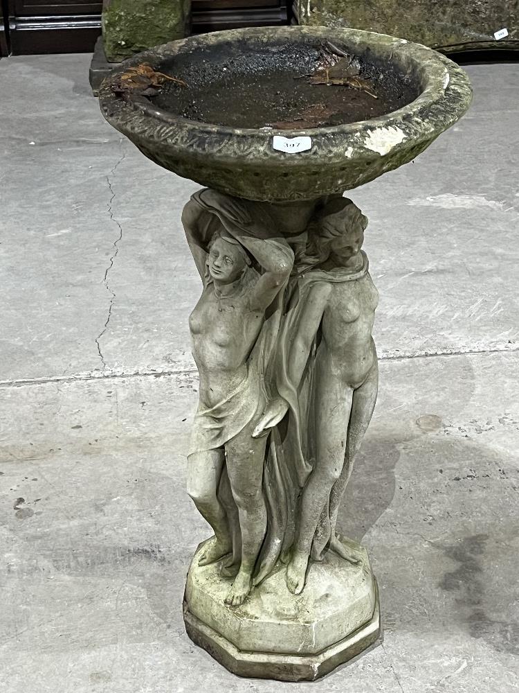 A statuary birdbath, the base moulded as the Three Graces after Canova. 30' high