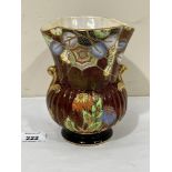 A Crown Devon Fieldings lustre vase, gilded and painted with a spider's web, honesty and other