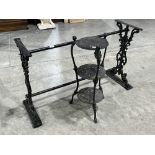 A 44' cast iron table base and a cast iron three tier pan stand