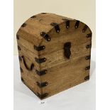 A teak domed box with applied iron angles and divided interior. 12¼'w x 14¼'h