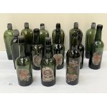 A collection of fourteen 19th century green glass ale and gin bottles