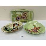 Carlton Ware. A rectilinear lustre dish and two bowls. 12' wide and smaller.