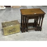 An oak nest of tables and a brass embossed coalbox