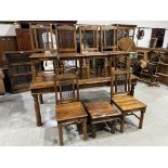 An Eastern hardwood dining table and six chairs, the lot to include a similar occasional table.