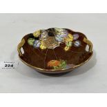 A Crown Devon Fieldings dish, gilded and painted with a spider's web, honesty and other foliage. 6¼'
