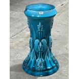 An early 20th century blue glazed jardiniere pedestal by Clement Messier, moulded in high relief