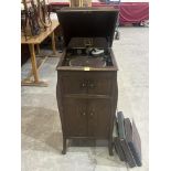 A 1930s HMV oak cased gramophone, the lot to include a quantity of records