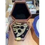 A brass sextant. Boxed. Of recent manufacture