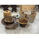 A collection of stoneware and old bottles