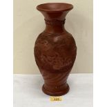 An early 20th century Japanese Tokoname red clay dragon vase. 12' high. Chip to rim and foot