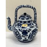 A Chinese blue and white teapot, decorated with dragons. Six figure character mark to base. 12'
