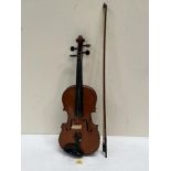 A violin with bow. Length of back 14'. Leather cased