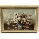 MARION BROOM R.W.S. BRITISH 1878-1962 Still life of magnolia in a blue glazed jug. Signed. Oil on