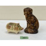 Two pottery animalier moneybanks, the spaniel. 5' high