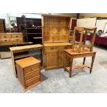 A small pine dresser; a pine bedside chest; a glazed bookcase; a pine table and a stool (5)