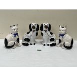 A pair of Staffordshire models of Spaniels and a pair of Staffordshire Cats, 8' high. (4)