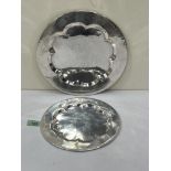 A graduated pair of silvered brass communion plates, possibly 18th century. 11½' diam and smaller