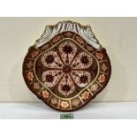 A Victorian Derby Imari dish of quatrefoil shape and gilded. Date cipher for 1887. 9¼' wide