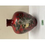 A Bretby oviform vase, decorated with two owls, trees and moon on a mottled red glaze. 9¾' high