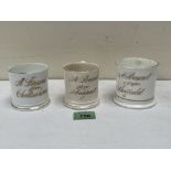 Three Victorian souvenir mugs inscribed in gilt with Cheltenham, Newport and Sheffield