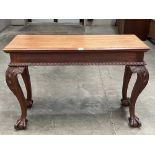 A 19th century mahogany serving table on acanthus carved cabriole legs with ball and claw feet.
