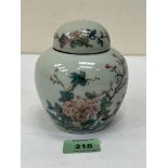 A 20th century Chinese jar and cover, painted with chrysanthemums, birds on prunus. 4¾' high