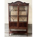 An Edward VII mahogany china display cabinet enclosed by a pair of astragal glazed doors. 40'w x