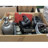 A box of soda syphons, acetylene and other vintage lamps etc.