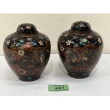 A pair of Japanese cloisonne enamel jars and covers. 4½' high. Both with a loss to enamel