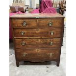 A George III elm chest in two parts, fitted with two short over three long drawers on bracket