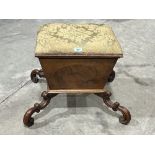 A Victorian walnut sarcophagus box stool with upholstered lid on double c-scroll carved legs. 17'