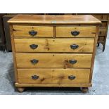 A Victorian pine chest of drawers on turned feet. 41' wide