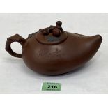 A Chinese Yixing Zisha clay teapot. 7¾' long over handle. Seal mark to base