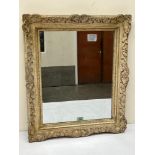 A wall mirror with moulded gesso frame. 25½' h x 21½' w