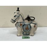 An oriental figure of a horse with metal mounts. 5¾' high