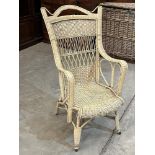 An early 20th century cane and bentwood armchair