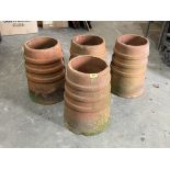 Four terracotta chimney pot planters. 18' high