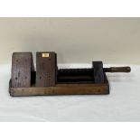 An early 20th century treen bench vice. Stamped mark 'HAY'. 23' long