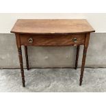 A George IV mahogany bowfronted side table, the line inlaid and crossbanded top over a frieze