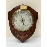 An Edward VII mahogany and inlaid aneroid barometer with silvered dial. 9¾' high