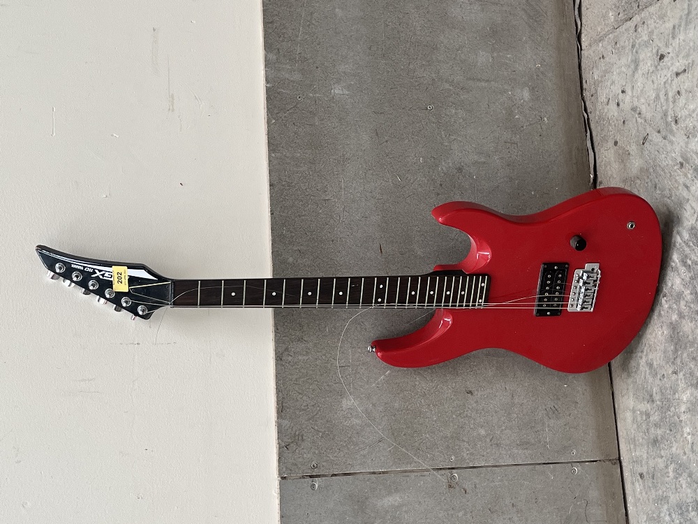 A Yamaha RGX-110 electric guitar